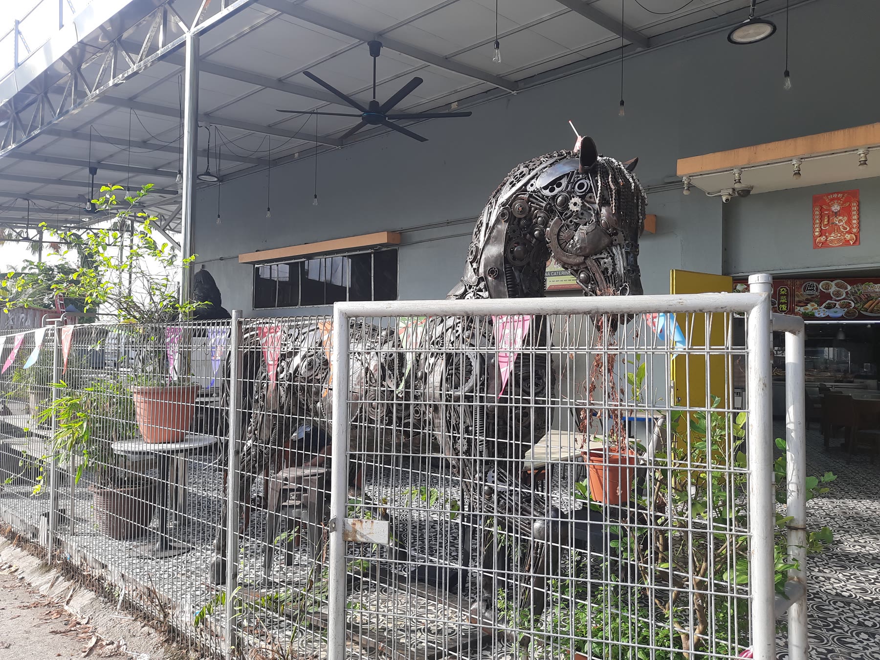 A large welded-metal sculpture at the JOURNIE Art Find