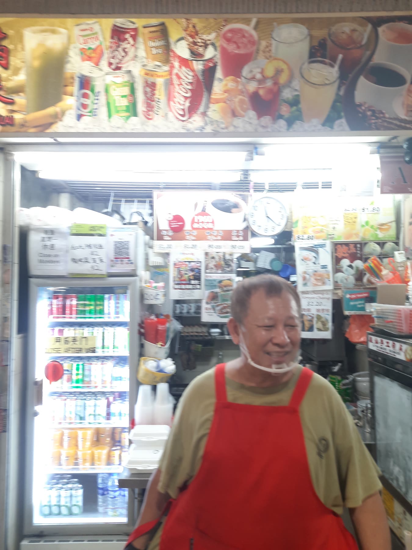John serving customers at Man Lai in Upper Boon Keng Market and Food Centre