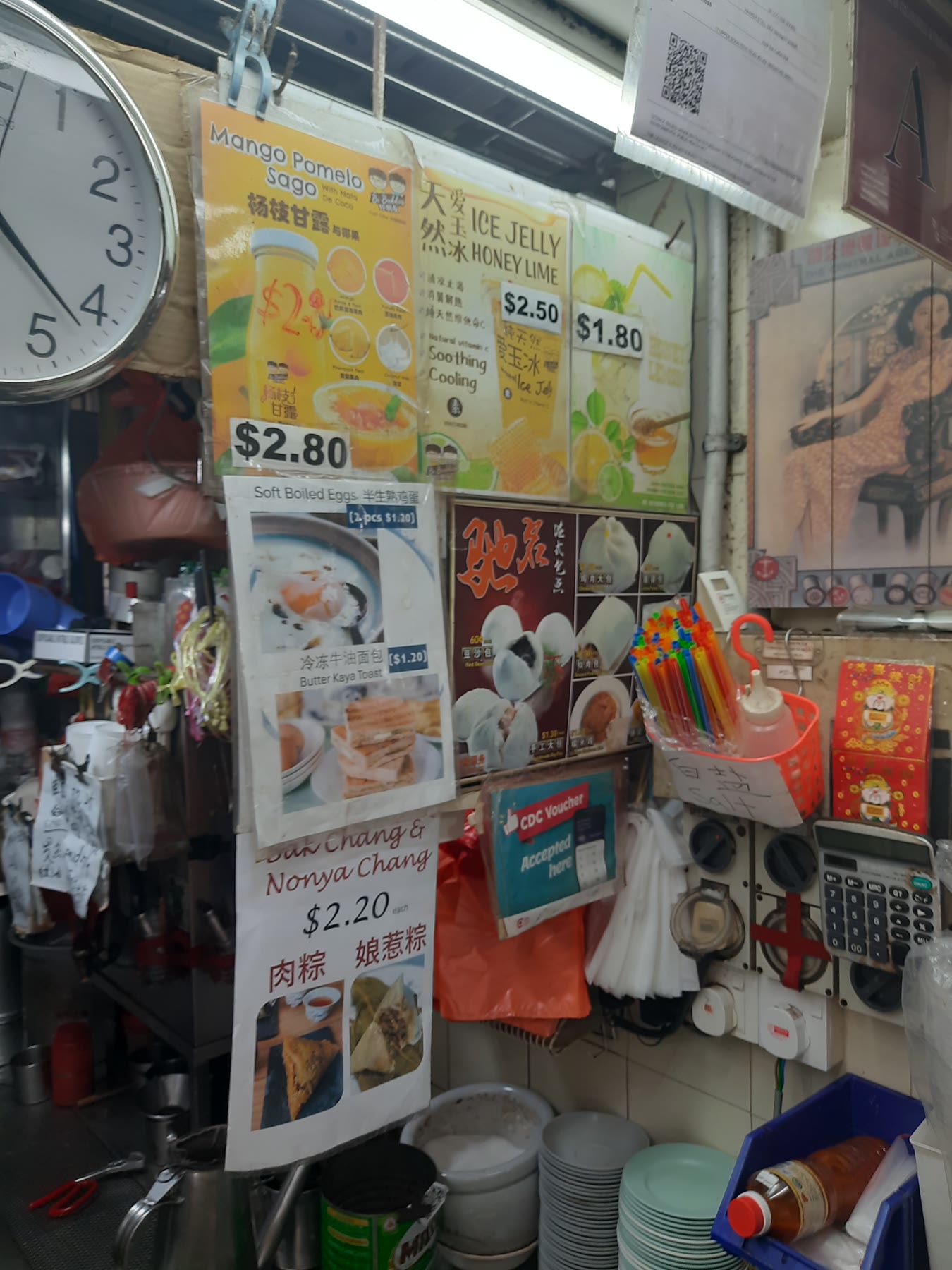 Menu posters and counter details at Man Lai